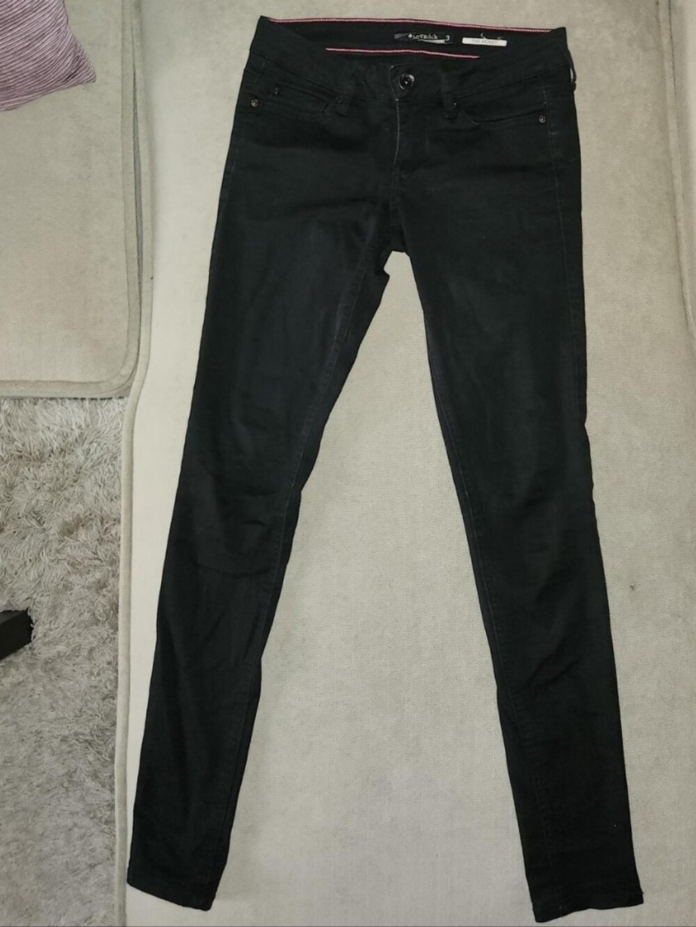 Lowrise Black Skinny Jeans With Heart & Skull Detail.